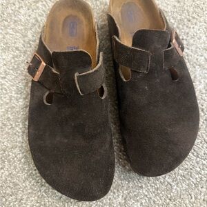 Birkenstock clogs in a dark brown color